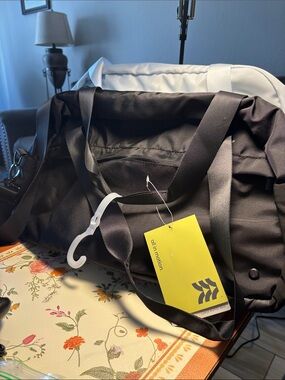 all in motion Black Men’s Duffel Bag with Yellow Tag